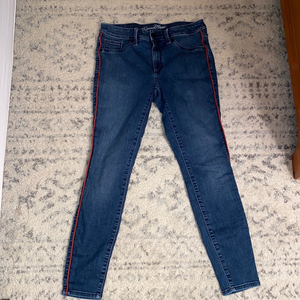 Target skinny blue jeans with red accent line down the side